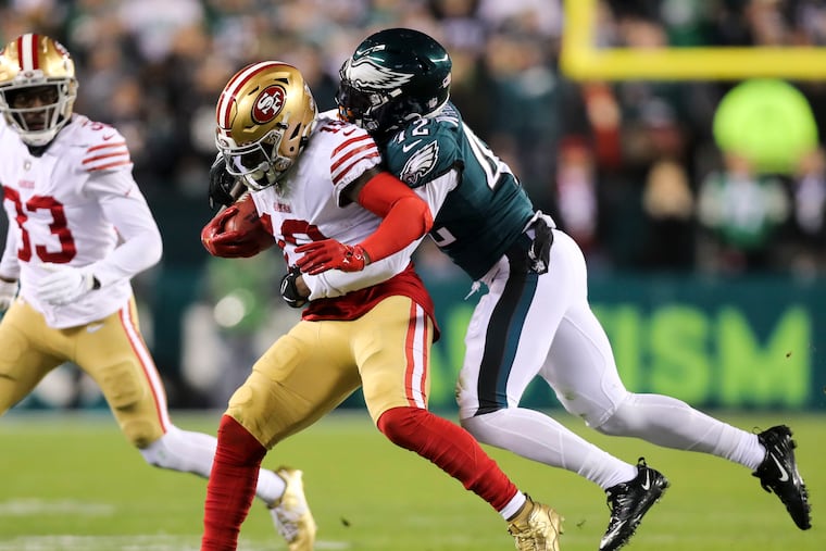 San Francisco 49ers wide receiver Deebo Samuel gets tackled by K'Von Wallace during the second half of the NFC championship game last season.