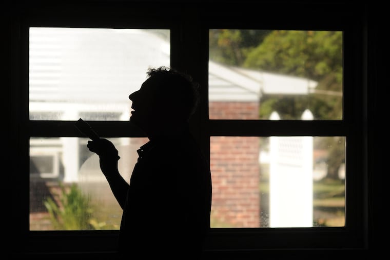 An inspector checks for possible problems in a home on the market.