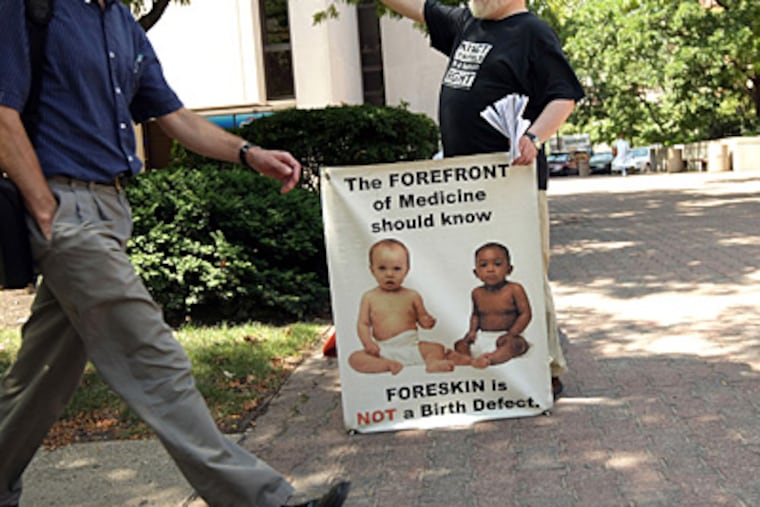 Dan Strandjord protests circumcision on the University of Chicago campus in Chicago. (Terrence Antonio James/Chicago Tribune/MCT)