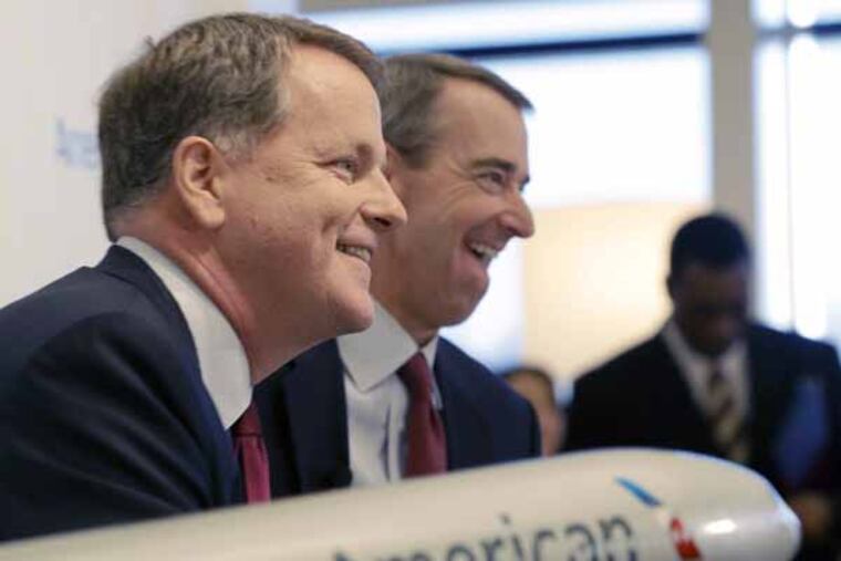 U.S. Airways CEO Doug Parker, left, and American Airlines CEO Tom Horton laugh during a news conference at DFW International Airport Thursday, Feb. 14, 2013, in Grapevine, Texas. The two airlines will merge forming the world's largest airlines. (AP Photo/LM Otero)