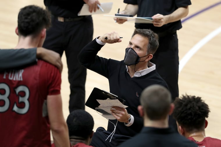 Coach Billy Lange of St. Joseph’s talks to his team duting a timeout at Villanova on Dec. 19, 2020 at the Finneran Pavilion at Villanova University.