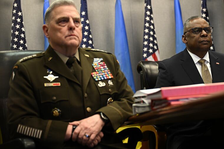 Defense Secretary Lloyd Austin, right, and Chairman of the Joint Chiefs of Staff Gen. Mark Milley, attend a virtual meeting of the Ukraine Defense Contact Group on Wednesday at the Pentagon in Washington.