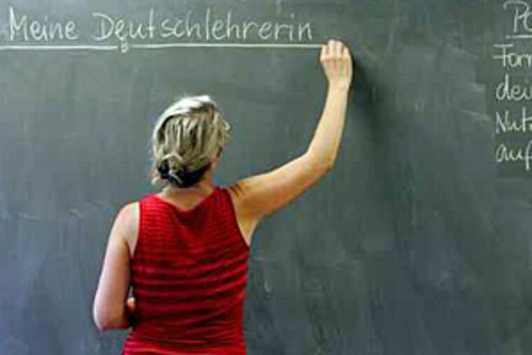 Solveigh Vogt writes the day's lesson on the board for her fourth period class. She's a German teacher at Upper Dublin High in Fort Washington.