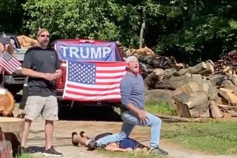 Image from video posted on Instagram showing one man kneeling on the neck of another man mocking the death of George Floyd while a Black Lives Matter march was passing by on Monday in Franklin Township, Gloucester County.