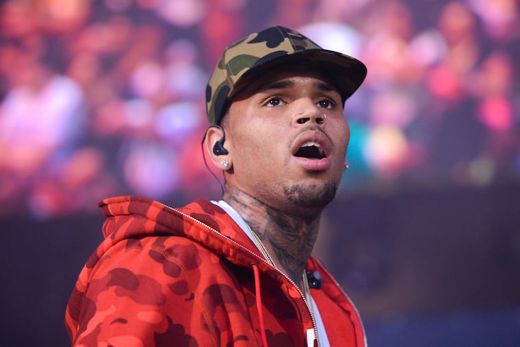 In this June 7, 2015 file photo, Chris Brown performs at the 2015 Hot 97 Summer Jam at MetLife Stadium in East Rutherford, N.J. (Photo by Scott Roth/Invision/AP, File)