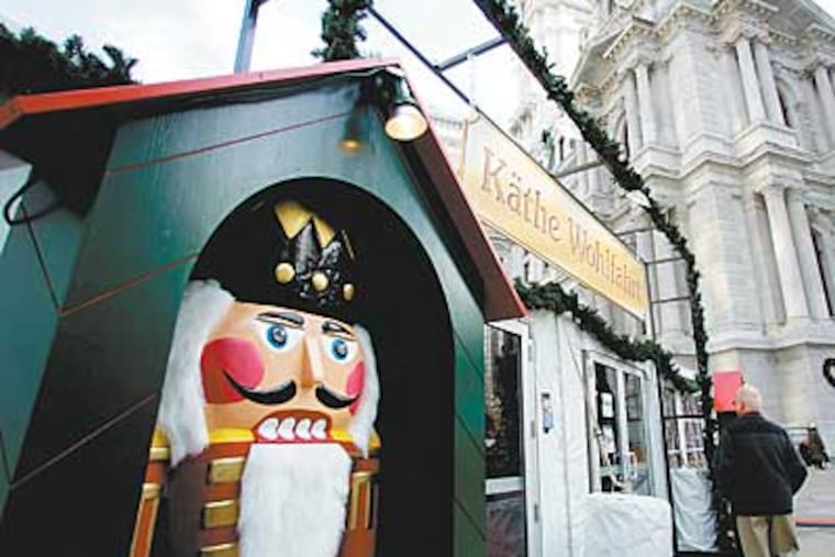 The skirt of City Hall has been been transformed into an open-air, old-style German Christmas crafts market. ( David Swanson / Staff Photographer)