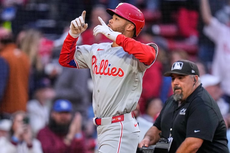 The Phillies' Justin Crawford celebrates while crossing home plate on his solo home run against the Red Sox on Wednesday.