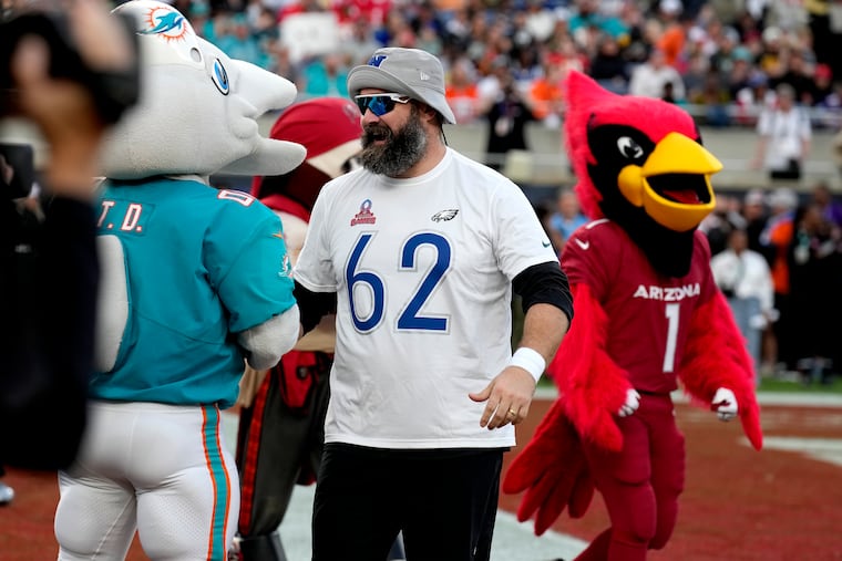 Eagles center Jason Kelce laughs with team mascots during the flag football event at the NFL Pro Bowl on Sunday.