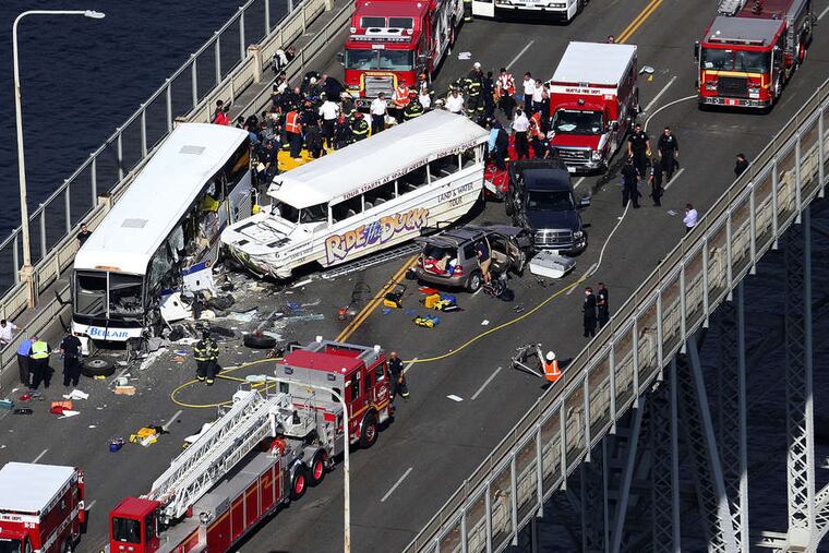 The accident scene , on Seattle's Aurora Avenue bridge. Jahna Dyer, a passerby and nurse, described a mess of metal and glass, with some victims lying on the road and others milling about. KEN LAMBERT / Seattle Times