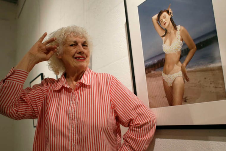 Bunny Yeager poses in 2013 next to a self-portrait from 1952. (LYNNE SLADKY / ASSOCIATED PRESS)