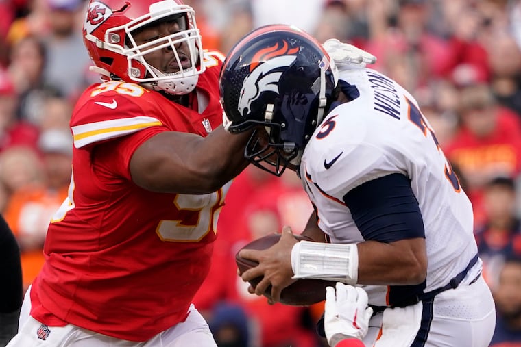 Chiefs All-Pro defensive tackle Chris Jones hits Broncos quarterback Russell Wilson on Jan. 1. Jones is a finalist for NFL defensive player of the year.