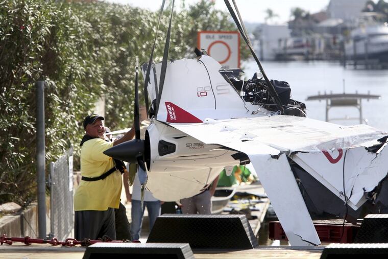 The remains of an ICON A5 ultralight airplane are moved from a boat ramp in the Gulf Harbors neighborhood of New Port Richey, Fla., on Wednesday, Nov. 8, 2017. The private plane, which belonged to Roy Halladay had just been removed from the shallow waters off Ben Pilot Point in New Port Richey where it crashed Tuesday, killing the 40-year-old former Toronto Blue Jays and Philadelphia Phillies pitcher. (Douglas R. Clifford/Tampa Bay Times via AP)