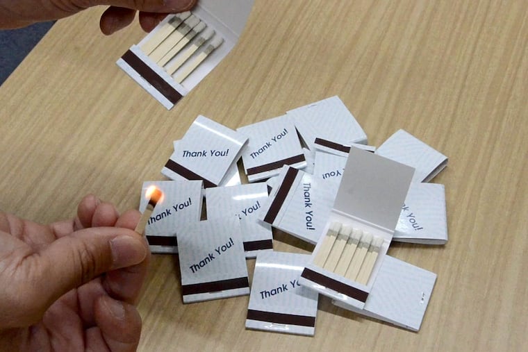 Matchbooks used as an advertising item with text and designs on a folded paper at Nittosha Co. in Himeji, Hyogo Prefecture. (Japan News-Yomiuri photo.)