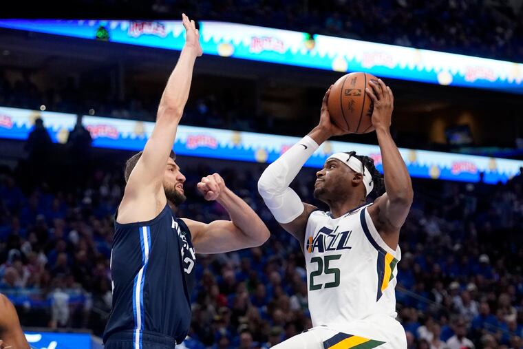 Dallas Mavericks forward Maxi Kleber, left, defends as Utah Jazz forward Danuel House Jr. (25) goes up to take a shot.