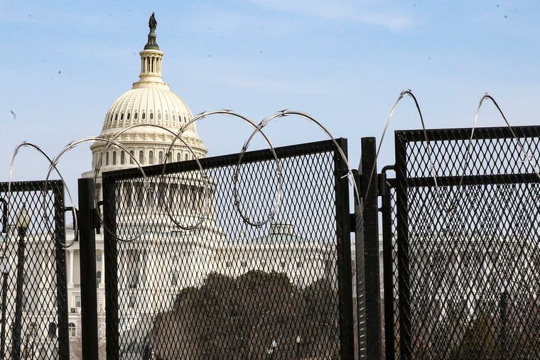 About 4 miles of fencing put up by Capitol Police to protect the U.S. Capitol after the building was attacked on Jan. 6.