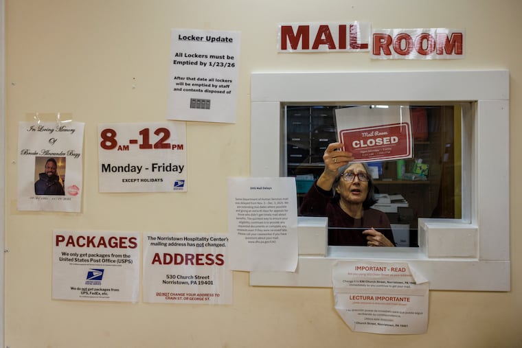 Beth Sturman, a part-time program manager, steps in to manage the mail room for users of Norristown Hospitality Center to pick up their mail last week.