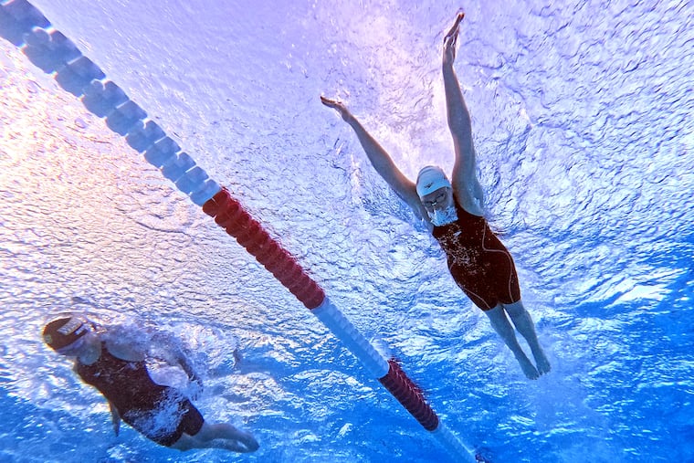 South Jersey’s Audrey Derivaux (left) is just 14, but she’s qualified for the Olympic trials in six events. Here, she's competing against Katie Forrester in the women's 200m futterfly final at the TYR Pro Swim Series in April in San Antonio.