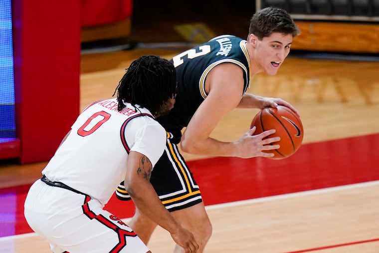 St. John's Posh Alexander defends Villanova's Collin Gillespie during their game on Feb. 3.