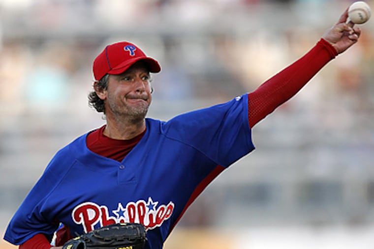 Philadelphia Phillies starting pitcher Jamie Moyer throws in the first inning against the Yankees. AP Photo/Mike Carlson)