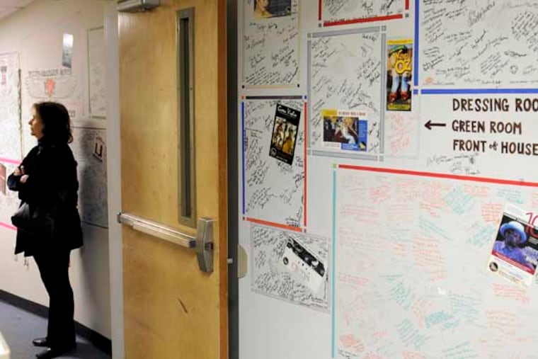 Marjorie Samoff, one of the founders, in 1984, of the American Music Theater Festival looks at the "Wall of Fame," in the hallway of the Prince Music Theater January 14, 2013. The Prince Music Theater grew out of the AMTF, and was established at the renovated Midtown Theater in 1999, where every actor, director, choreographer and singer who has come through the door since then has signed the basement hallway walls. ( TOM GRALISH / Staff Photographer )