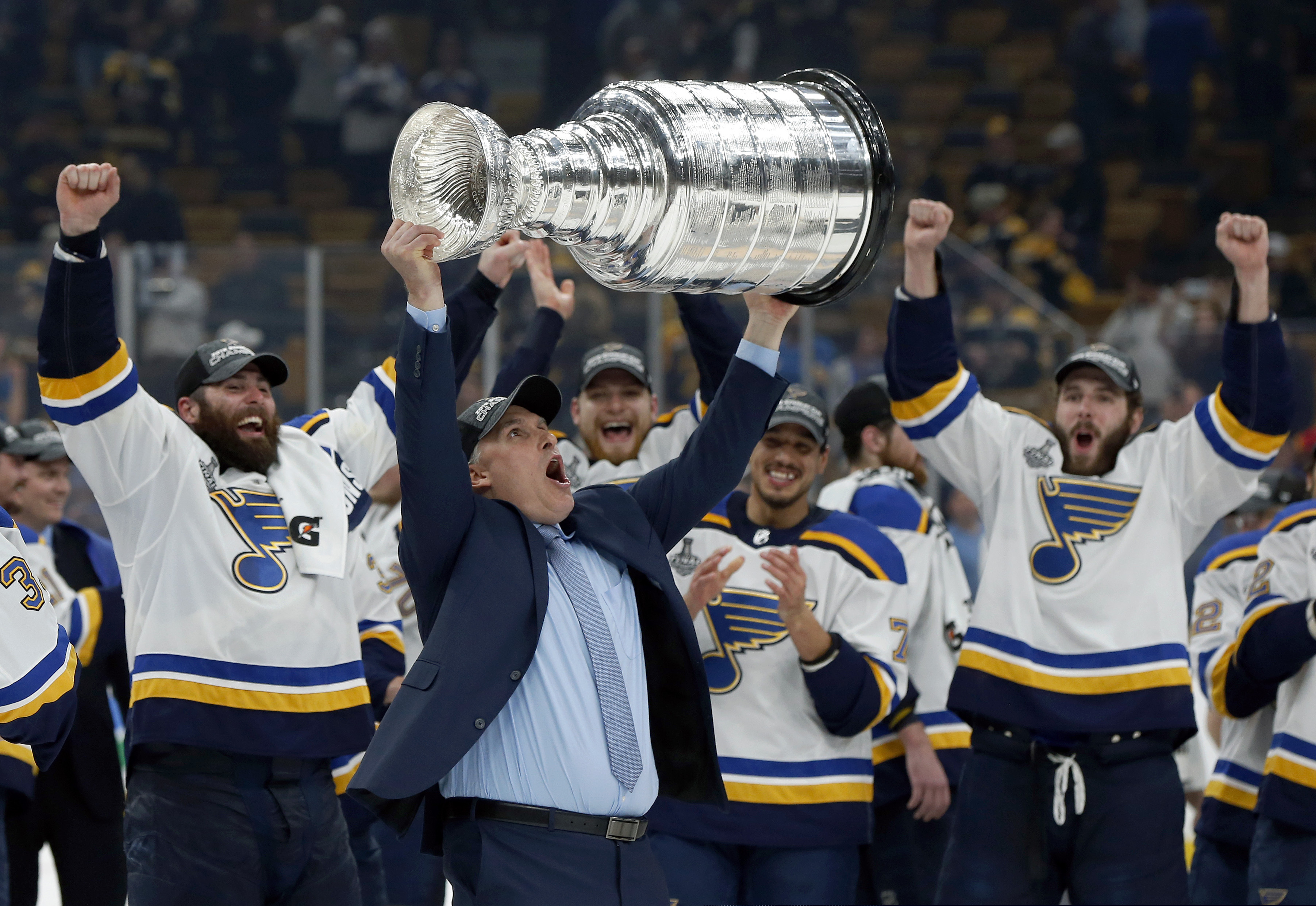 St. Louis Blues head coach Craig Berube hoists the Stanley Cup.