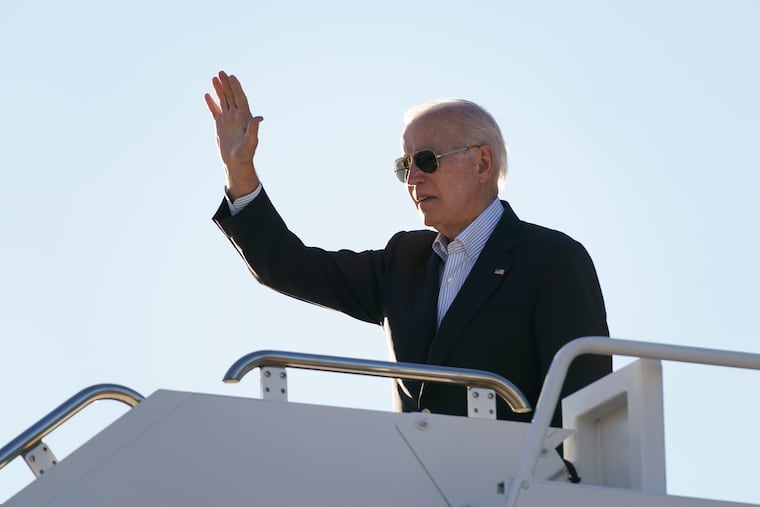 President Joe Biden waves before boarding Air Force One at El Paso International Airport in El Paso, Texas, on Sunday.