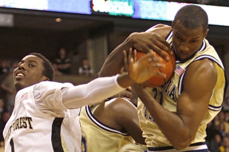 Gani Lawal's, right, early fouls against Duke hurt Georgia Tech. (AP Photo/Rick Havner)