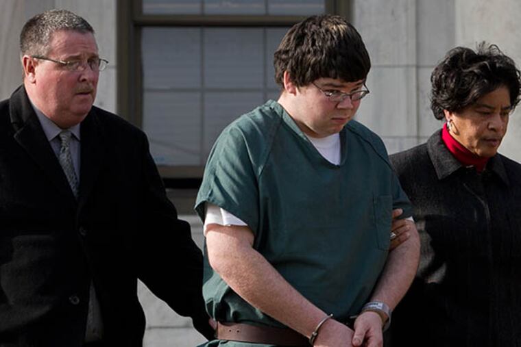 John Corcoran is escorted out of the Delaware County Courthouse in Media to a waiting police car on Friday, January 23, 2015. ( ALEJANDRO A. ALVAREZ / STAFF PHOTOGRAPHER )