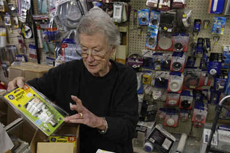 Every inch an old-fashioned hardware store, Wallace Hardware in Ocean City, N.J., has defied depressions, recessions, big-box trends. Above, matriarch Gladys Wallace, 80, prices a newfangled energy-saving light bulb. (Michael S. Wirtz / Staff Photographer)