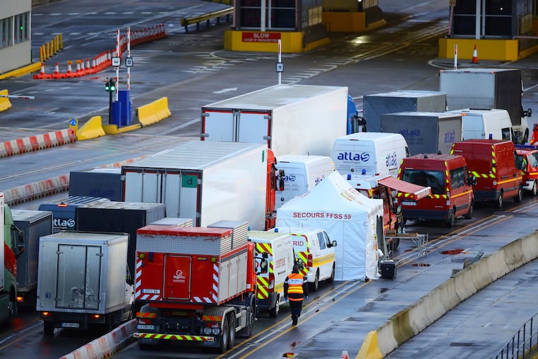 Vehicles queue to move into the departures boarding area as COVID-19 tests are carried out at the Port of Dover in Kent, where thousands are waiting to resume their journey across The Channel on Thursday.