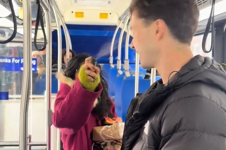 Francis Scales, 22, a local political influencer, gets pepper-sprayed in the face on the SEPTA 7 bus on Jan. 21.