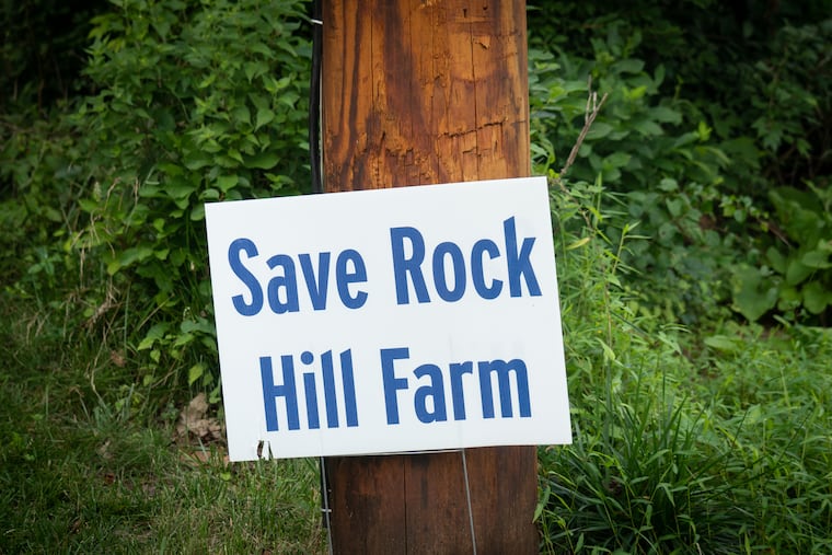 A sign from the grassroots campaign "Save Rock Hill Farm" on the street across from Rock Hill Farm in Paoli, Tuesday, Aug. 2, 2022.