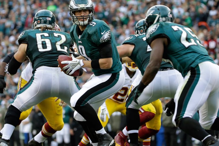 Eagles quarterback Nick Foles turns from the pocket during the first half of an NFL football game against the Washington Redskins in Philadelphia, Sunday, Nov. 17, 2013. (Matt Slocum/AP)