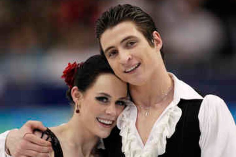 Tessa Virtue and Scott Moir react after their original dance.