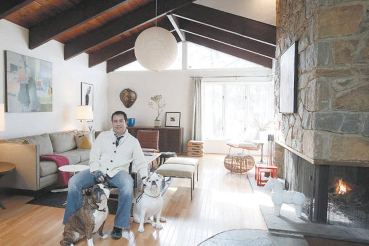 George Marrone with his dogs Sophie and Sasha in the living room. Themed-century-modern house was built in 1959 by an artist. January 23,2013. MICHAEL S. WIRTZ / Staff Photographer ).