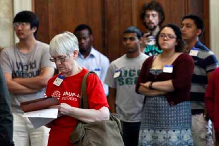 Students and others listen to testimony on the merger plan during the Senate committee hearing in Trenton. MEL EVANS / Associated Press