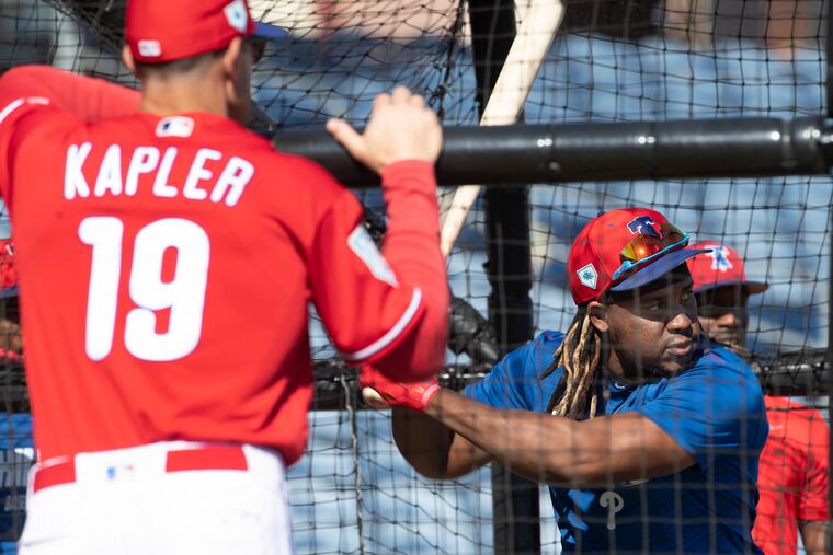 Phillies manager Gabe Kapler watching Maikel Franco take batting practice in Clearwater, Fla.