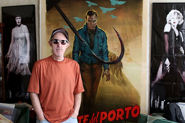 Mark del Costello , photographer, film and music promoter, and movie poster collector, stands in front of an "On the Waterfront" poster at his home in Burlington City. DAVID SWANSON / Staff Photographer