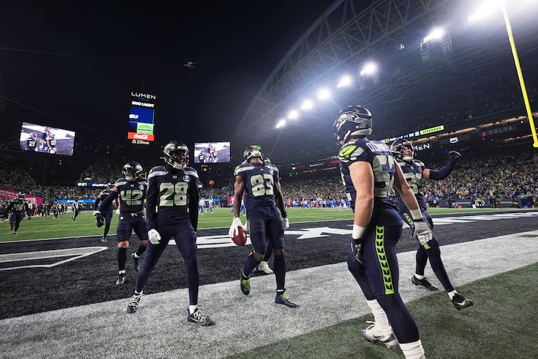 Seattle Seahawks' Dareke Young (83) celebrates after recovering a fumble by Los Angeles Rams wide receiver Xavier Smith during a punt return during the second half of the NFC Championship NFL football game Sunday, Jan. 25, 2026, in Seattle. (AP Photo/Lindsey Wasson)