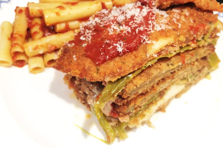 Cotoletta's signature "Stack," which layers chicken Parmesan, eggplant and sausage-stuffed long hot peppers, is available for takeout in a massive, lasagna-style family-sized pan.