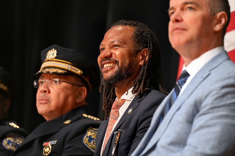 Chief Public Safety Director Adam Geer sits between Police Commissioner Kevin J. Bethel (left) and Managing Director Adam Thiel (right) during graduation ceremonies for the police academy Class #402 of the Philadelphia Police Department and Temple University Police Department in June. Geer was appointed to oversee the new Office of Public Safety.