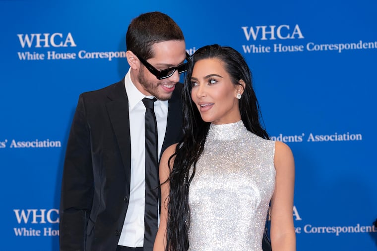 Kim Kardashian and Pete Davidson pose for photographers as they arrive at the annual White House Correspondents' Association Dinner.
