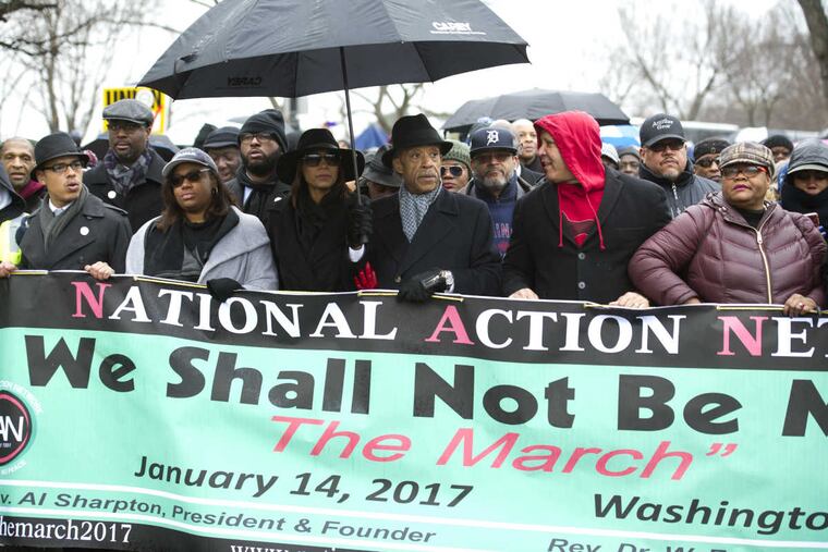 Rev. Al Sharpton, center, and civil rights advocates march to honor the Rev. Martin Luther King, Jr. in Washington, Saturday, Jan. 14, 2017. The National Action Network, the group founded by the Rev. Al Sharpton, sponsored Saturday's "We Shall Not Be Moved" march and rally ahead of Monday's Martin Luther King Jr. Day holiday.