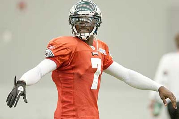 Michael Vick at practice Wednesday, wearing a glove on his injured right hand. (Clem Murray/Staff Photographer)