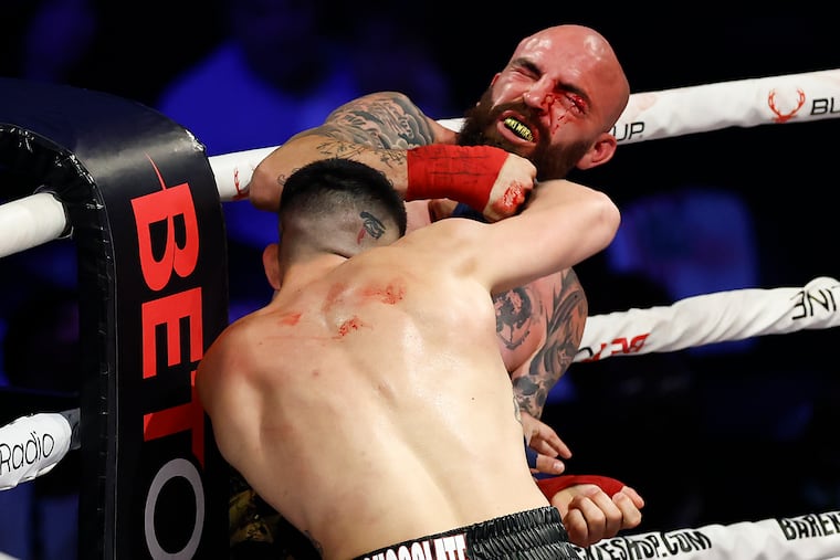Brandon Honsvick (right) gets hit by Matt Turnbull in a lightweight bout during BKFC's Liberty Brawl on Friday at Xfinity Mobile Arena. Turnbull beat Honsvick via technical knockout.