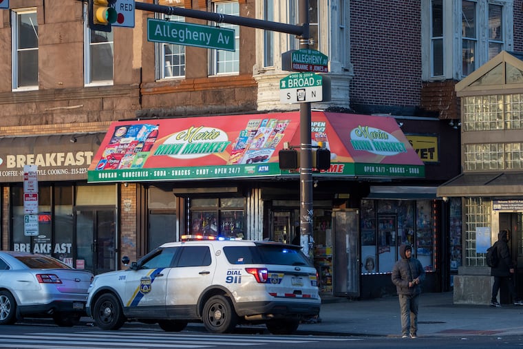 A Philadelphia police car at the corner of North Broad Street and West Allegheny Avenue, where the son of a police officer was shot and killed early Monday morning.