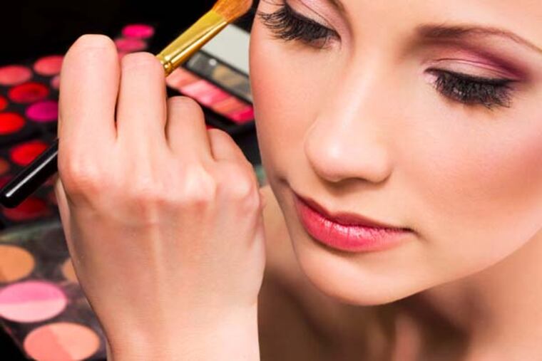 Makeup artist applying eyeshadow