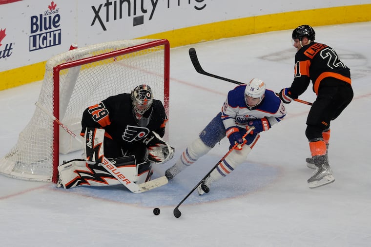 Carter Hart (left) stops a shot by Zach Hyman during the first period. Hart and the Flyers picked up their first shootout win of the season.