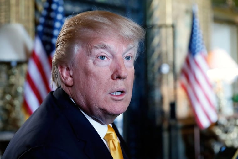 President Trump speaks to the media before speaking with members of the armed forces via video conference at Mar-a-Lago in Palm Beach, Fla., on Thanksgiving Day.