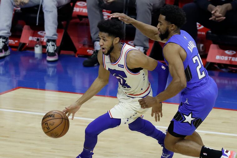 Sixers guard Isaiah Joe dribbling against Orlando Magic guard Chasson Randle on May 16.